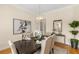 Elegant dining room with a stylish chandelier and formal table setting at 4457 Equity Ct, Ellenwood, GA 30294