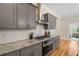 Stylish kitchen with granite countertops, stainless steel appliances, and a sleek design, perfect for the home chef at 4457 Equity Ct, Ellenwood, GA 30294