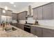 Modern kitchen with sleek granite countertops, stainless steel appliances, and ample cabinet space for storage at 4457 Equity Ct, Ellenwood, GA 30294