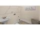Laundry room with sink, tile flooring, washer-dryer hook ups and laundry hamper at 4457 Equity Ct, Ellenwood, GA 30294