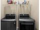 Modern laundry room equipped with stainless steel washer and dryer, and ample storage for convenience and efficiency at 4457 Equity Ct, Ellenwood, GA 30294