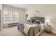Bedroom with a large window, comfortable bed, and stylish decor at 4457 Equity Ct, Ellenwood, GA 30294