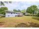 Spacious backyard featuring a deck, partial fencing, and a shed at 5251 Joan Of Arc Pl, Atlanta, GA 30349