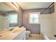 Traditional bathroom with tile floors, a vanity, and natural light at 5251 Joan Of Arc Pl, Atlanta, GA 30349