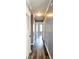 Bright hallway featuring wood-look flooring and neutral paint at 5251 Joan Of Arc Pl, Atlanta, GA 30349