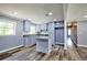 Updated kitchen featuring granite countertops, an island, stainless steel appliances, and ample storage at 5251 Joan Of Arc Pl, Atlanta, GA 30349