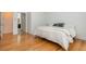Bedroom with hardwood floors and neutral walls. Connected ensuite bathroom at 133 Newcastle Walk, Woodstock, GA 30188