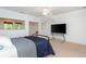 Bright bedroom with neutral carpet, a comfortable bed, and a well-lit sitting area at 133 Newcastle Walk, Woodstock, GA 30188