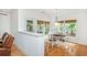 Bright breakfast nook with four windows, hardwood floors, and neutral decor at 133 Newcastle Walk, Woodstock, GA 30188