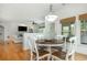 Bright breakfast nook with four windows and a clear view into the open concept living room at 133 Newcastle Walk, Woodstock, GA 30188