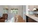 Open concept dining area featuring hardwood floors, recessed lighting and a wall of windows at 133 Newcastle Walk, Woodstock, GA 30188