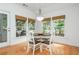 Cozy breakfast nook with natural light, hardwood floors, and views of the private backyard at 133 Newcastle Walk, Woodstock, GA 30188