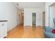 Bright living room with hard wood floors that connect to multiple rooms at 133 Newcastle Walk, Woodstock, GA 30188