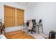 Bright office with a large window, a desk with computer and a rolling office chair at 133 Newcastle Walk, Woodstock, GA 30188