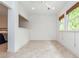 Bright sitting area with tile flooring and large windows with natural light at 133 Newcastle Walk, Woodstock, GA 30188