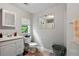 Bathroom features neutral paint, natural light from the window, and simple decor at 3750 Mckown Rd, Douglasville, GA 30134