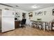 Bright dining area features an office nook, decor, modern table with four chairs, and neutral paint at 3750 Mckown Rd, Douglasville, GA 30134