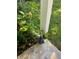 Hydrangea plant and corner detail of porch showing home's exterior at 3750 Mckown Rd, Douglasville, GA 30134