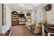 Relaxing sitting area with a large window, ample storage, and cozy decor, ideal for unwinding and enjoying leisure time at 3750 Mckown Rd, Douglasville, GA 30134