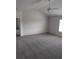 Large bedroom offers neutral carpet, ample space, and plenty of natural light at 415 Rodeo Dr, Auburn, GA 30102