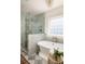 Bathroom features a glass shower, freestanding tub, and stylish checkerboard tile at 427 Cherokee Se Ave, Atlanta, GA 30312
