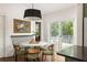 Bright breakfast nook featuring an elegant table setting, hardwood floors, and outdoor access at 427 Cherokee Se Ave, Atlanta, GA 30312