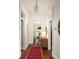 Bright hallway with hardwood floors, leading to a dining area and featuring elegant lighting at 427 Cherokee Se Ave, Atlanta, GA 30312