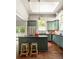 Stylish kitchen with sage green cabinets, stainless steel appliances and dark countertops at 427 Cherokee Se Ave, Atlanta, GA 30312