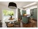 Open kitchen and breakfast area featuring hardwood floors, stainless steel appliances, and bright natural light at 427 Cherokee Se Ave, Atlanta, GA 30312