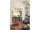 Comfortable living room showcases green kitchen view with hardwood floors and natural light at 427 Cherokee Se Ave, Atlanta, GA 30312