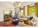 Bright living room featuring hardwood floors, high ceilings, and a view of the kitchen at 427 Cherokee Se Ave, Atlanta, GA 30312