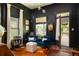 Stylish living room with dark walls, hardwood floors, and sophisticated decor, with bright light at 427 Cherokee Se Ave, Atlanta, GA 30312