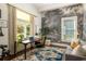 Office features a large window, vintage-inspired wallpaper, and neutral decor at 427 Cherokee Se Ave, Atlanta, GA 30312