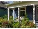 Relaxing covered porch area with comfortable seating surrounded by lush greenery and natural light at 427 Cherokee Se Ave, Atlanta, GA 30312