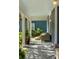 Cozy porch featuring wicker furniture, patterned rugs, and views of the beautiful neighborhood landscape at 427 Cherokee Se Ave, Atlanta, GA 30312