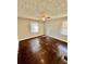 Bedroom with a ceiling fan, hardwood floors, and two windows at 1292 Lorenzo Sw Dr, Atlanta, GA 30310