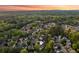 Scenic aerial shot showcases homes surrounded by mature trees in a peaceful community at 422 Laurian Nw Way, Kennesaw, GA 30144