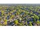 An aerial view shows the property nestled in a lush, green neighborhood with mature trees and well-maintained homes at 422 Laurian Nw Way, Kennesaw, GA 30144