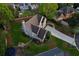 Aerial view shows a landscaped property with a well-maintained lawn, mature trees, and a private backyard at 422 Laurian Nw Way, Kennesaw, GA 30144