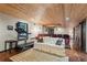 Finished basement with theater seating, wood ceiling and workout equipment at 422 Laurian Nw Way, Kennesaw, GA 30144