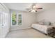 Bright bedroom with a daybed, neutral carpet, and a large window with outdoor views at 422 Laurian Nw Way, Kennesaw, GA 30144