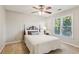 Comfortable bedroom with neutral colors, ceiling fan, and a view to the backyard at 422 Laurian Nw Way, Kennesaw, GA 30144