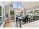 Sun-lit dining area with vaulted ceiling and a view of the fenced in backyard at 422 Laurian Nw Way, Kennesaw, GA 30144