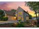 Charming two-story home boasts stone accents, lush landscaping, and a welcoming curb appeal at sunset at 422 Laurian Nw Way, Kennesaw, GA 30144