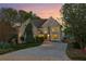 Charming two-story home with stone accents, a well-manicured lawn, and a long driveway leading to a two-car garage at 422 Laurian Nw Way, Kennesaw, GA 30144