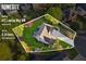 Aerial view shows landscaped property with a well-maintained lawn, mature trees, and a private backyard at 422 Laurian Nw Way, Kennesaw, GA 30144