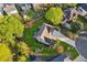 Aerial view shows the property nestled in a lush, green neighborhood with mature trees and well-maintained homes at 422 Laurian Nw Way, Kennesaw, GA 30144