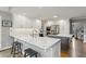 Spacious kitchen featuring white cabinets, stone counter tops and a center island with bar stool seating at 422 Laurian Nw Way, Kennesaw, GA 30144