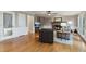 Cozy living room featuring a stone fireplace and gleaming hardwood floors, perfect for relaxation at 422 Laurian Nw Way, Kennesaw, GA 30144