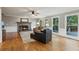 Inviting living room showcasing a stone fireplace, hardwood floors, and abundant natural light at 422 Laurian Nw Way, Kennesaw, GA 30144